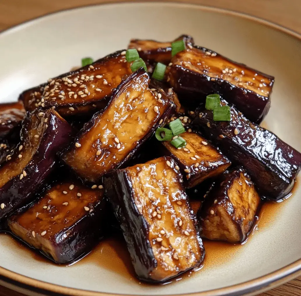 Finished miso glazed eggplant garnished with sesame seeds and green onions