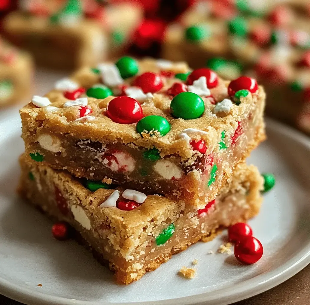 Close-up of perfectly cut Christmas cookie bars, showing moist texture and colorful festive add-ins.